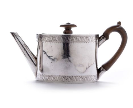 A Victorian silver teapot, by George Lambert, London 1874, of plain oval form with engraved leaf banding and dog pattern cres