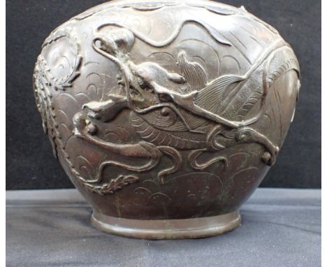 A JAPANESE BRONZE JARDINIEREcast with a dragon chasing a phoenix, the base cast and with character marks 21cm high (a/f, hole