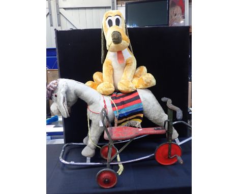 A MERRYTHOUGHT DONKEY, ON ROCKERS110cm long (a/f), a Walt Disney Distributing Co Pluto 66cm high, and a vintage toy tricycle 