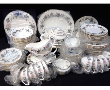 A ROYAL WORCESTER 'JUNE GARLAND' DINNER SERVICEsome retaining Royal Worcester plastic bags