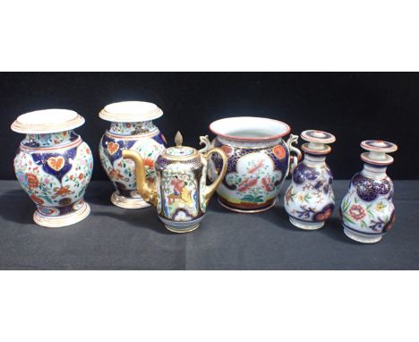 SIX FAMILLE ROSE STYLE WARESall with dark-blue ground background with gilt scrolling, including a pair of squat vases, a coff