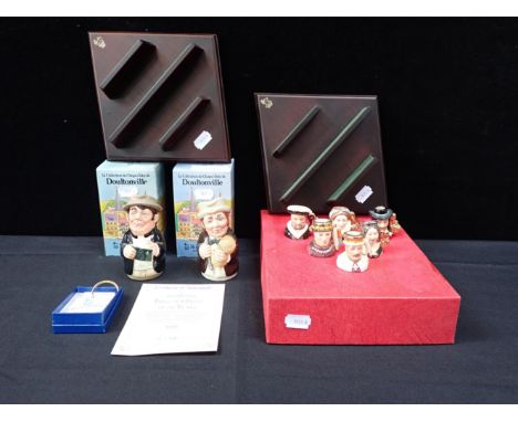 A COLLECTION OF ROYAL DOULTON 'TINIES' MINIATURE JUGSwith a display shelf with Rev Cassock and Mr Furrow toby jugs and a key 