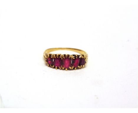 A LATE VICTORIAN FINE STONE RUBY RING  with graduated oval cuts, finger size L 1/2, 2.5g gross.