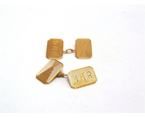 A PAIR OF 9 CARAT GOLD CUFFLINKS Birmingham 1931, the rectangular, monogrammed and engine turned panels to chain connectors, 