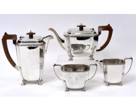 A FOUR PIECE SILVER TEA SERVICE  by Mappin and Webb, Sheffield 1938, of cut corner rectangular outline, on four nail head sup