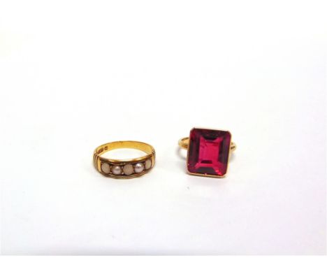 A 15CT GOLD RING set with simulated pearls, Chester 1880, finger size N, 2.9g gross; with a synthetic ruby set ring, stamped 