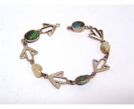 AN ART NOUVEAU TURQUOISE & FRESHWATER PEARL BRACELET  with arrow head like motifs in between, stamped 'Sterli', 18.8cm long.