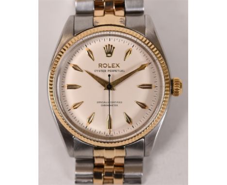 ROLEX, OYSTER PERPETUAL Officially Certified Chronometer, a gentleman's two colour bracelet watch, cream coloured dial with d