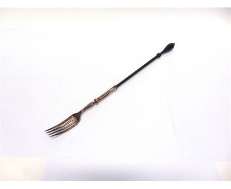 A GEORGIAN SILVER AND EBONY LONG HANDLED FORK maker's mark worn, no office mark, date letter possibly for London 1817, 43cm l