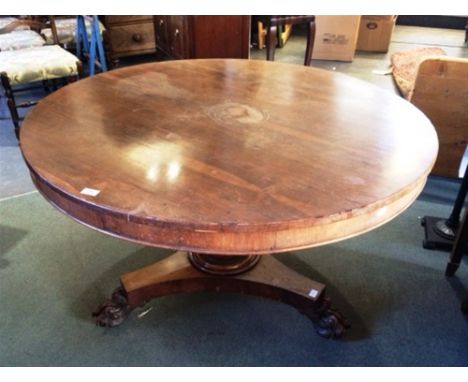 A VICTORIAN ROSEWOOD TILT TOP BREAKFAST TABLE  the circular top 120cm diameter, on pillar support with tripod base 72cm high 