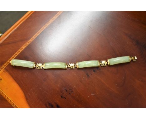 A 14ct gold & jade bracelet.