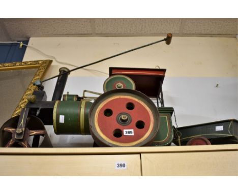 A scratch built floor toy of steam roller and trailer.