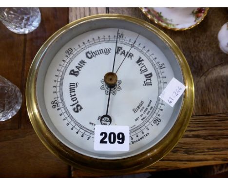 A brass ships barometer.
