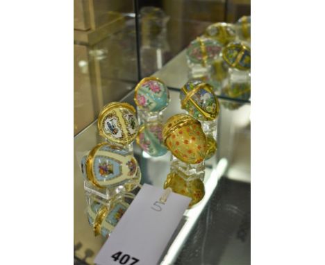 Five Halcyon Days enamel easter egg boxes comprising of 1987-1989-1990-2001-2005.