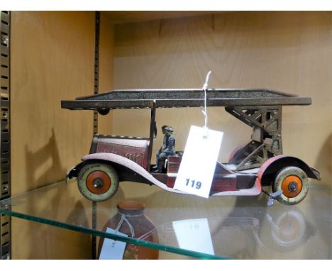 A 1930's tin toy clockwork fire engine 'Made in England' with 'Dunlop Fort' tyres, extendable ladder and two firemen a/f.