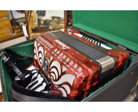 A Luciano 48 bass piano accordion. With case.