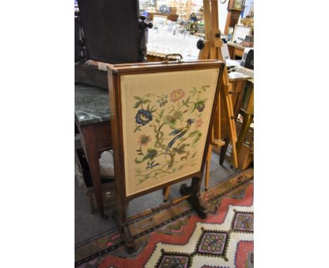 A 19th century metamorphic mahogany fire screen.