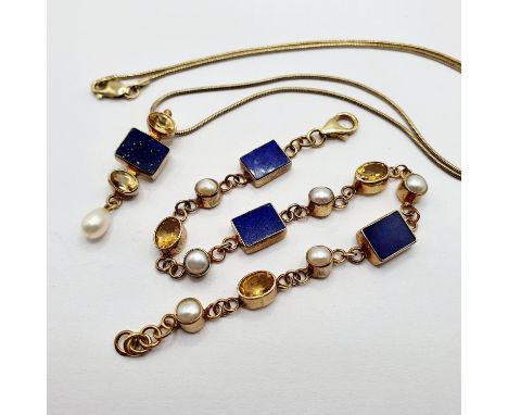 A yellow coloured metal, cultured pearl, yellow and blue stone pendant, on a chain, and a matching bracelet 