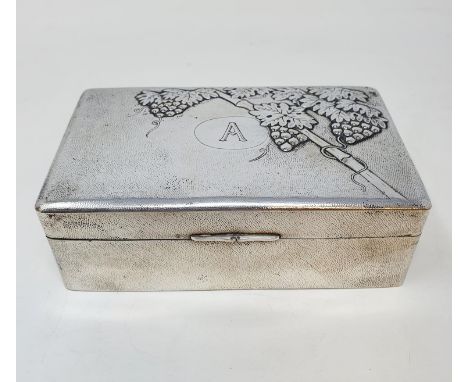 A Chinese silver coloured metal table cigarette box, initialled, and decorated grapes and foliage, 15 cm wide 