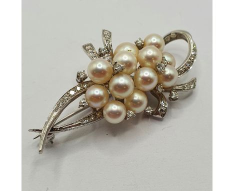 A 14ct white gold diamond and pearl brooch 