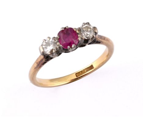 An 18ct gold, platinum ruby and diamond three stone ring, ring size J 1/2 