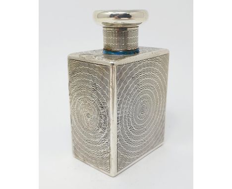 A silver scent bottle and stopper, with engine turned decoration, Goldsmiths & Silversmiths, Birmingham 1911, 9.5 cm high 