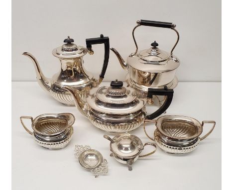 A silver plated four piece tea and coffee service, a kettle on a stand, a mustard pot, a tea strainer, and two twin handled t