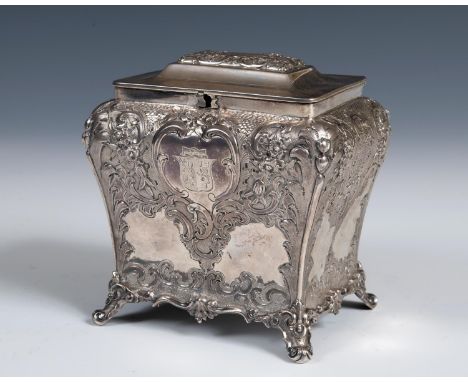 A mid 19th century Scottish silver tea caddy, engraved an armorial, and embossed with flowers and foliage, J Muirhead & Sons,