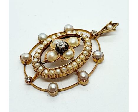 An early 20th century yellow metal, pearl and diamond pendantOverall condition good, no obvious faults, wire outer border sli