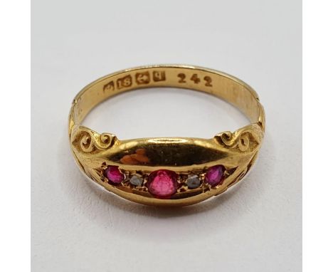 An 18ct gold and ruby ring, ring size N, 2.5 g (all in) 