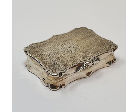 An early Victorian silver vinaigrette, of shaped rectangular form, initialed and with engine turned decoration, Birmingham 18