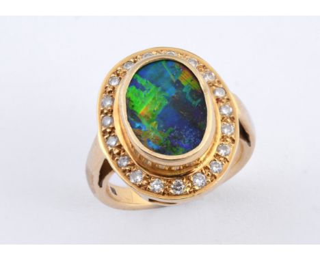 An 18ct gold Australian boulder opal and diamond ring, ring size MOpal including mount is 14.2 x 11.06 mm approx., 4.1 mm dee