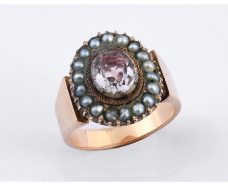 An antique yellow metal, pink stone and pearl ring, ring size M 
