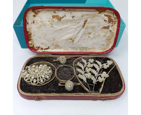 A seed pearl bar brooch, and other seed pearl jewellery, some loss and damages, in a leather case 