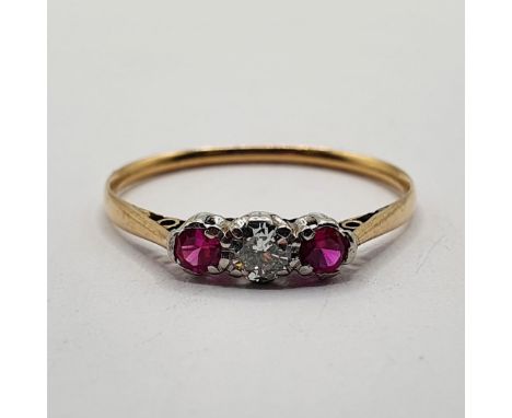 A yellow gold, ruby and diamond three stone ring, ring size Q1/2 