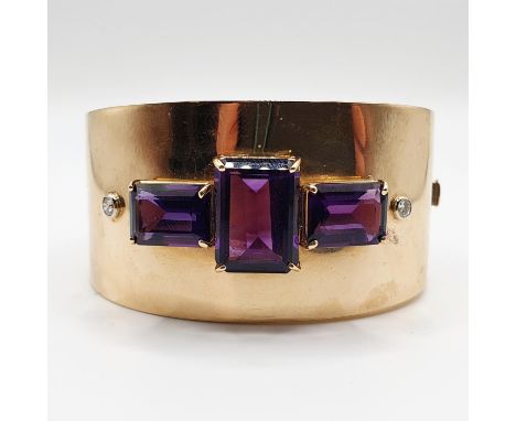 A 14ct gold, diamond and amethyst bangle, 57.8g70mm wide at widest point 