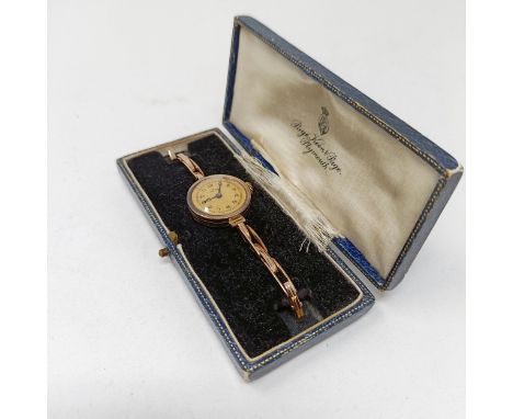 A vintage 9ct gold ladies' Rolex Watch, cased, retail mark for Page Keen and Page of Plymouth 