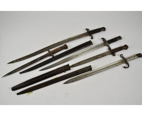 An Argentinian model 1891 bayonet and scabbard, together with a Yataghan style bayonet, two double edged bayonets and another