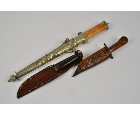 A vintage hunting knife by Fagan &amp; Son, complete with sheath, together with two Middle Eastern knives, one having bone ha