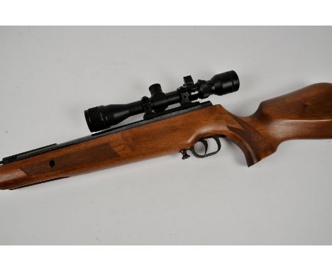 A Theoben .22 Cal air rifle, serial TB4008, together with Tasco 2-7x32 telescopic sight, in material carry casethere is a dif