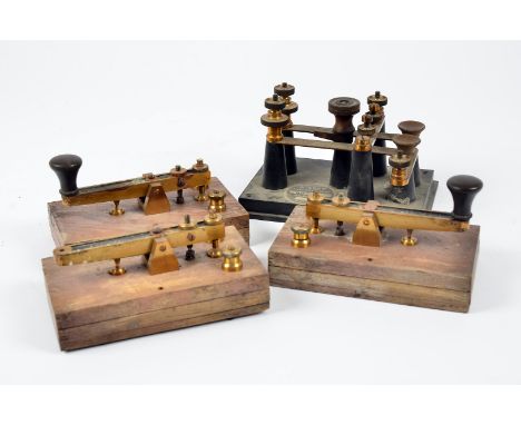 A group of four Morse Code keys, one having dual controls, in vintage briefcase (5)