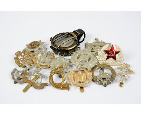 A small collection of British and Overseas cap badges, including London Rifle Brigade, King's Own Scottish Borders, South Wal