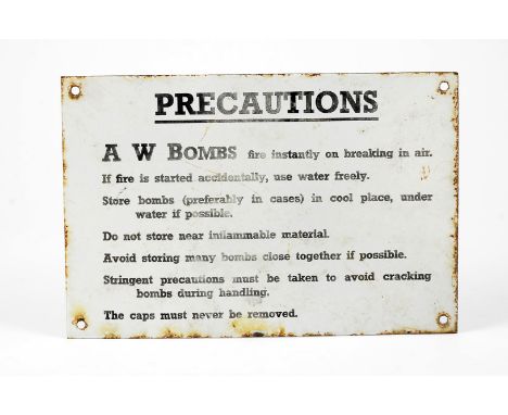 A  WWII 'Precautions' enamel sign, the sign instructing how to store A W Bombs (Special Incendiary), 30cm x 20cm