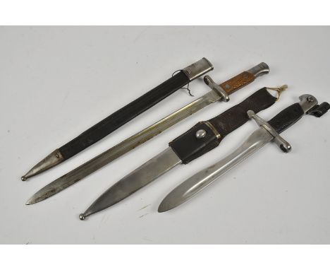 A Spanish M1913 bayonet, marked ARTILLERIA, TOLEDO, serial 7872, with steel and leather scabbard, together with Spanish 1941 