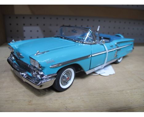 A Danbury Mint 1:24th Scale Diecast Model 1958 Chevrolet Impala, turquoise, boxed.