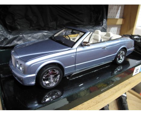 A  Minichamps 1:18th Scale Diecast Model #BL472 Bentley Azure 'Fountain Blue', displayed in Bentley dealer edition presentati