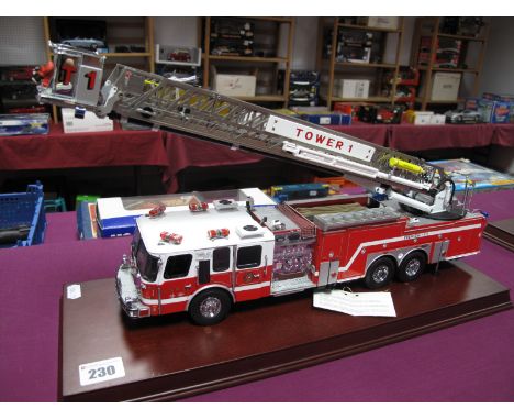 A Franklin Mint 1:32nd Scale Diecast Model Emergency One HP105 Platform 'Tower 1' Fire Truck, presented on a wooden display p