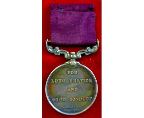 Army long service and good conduct medal, silver, pre 1901. Obverse, a trophy of arms reverse. The words' For Long Service An