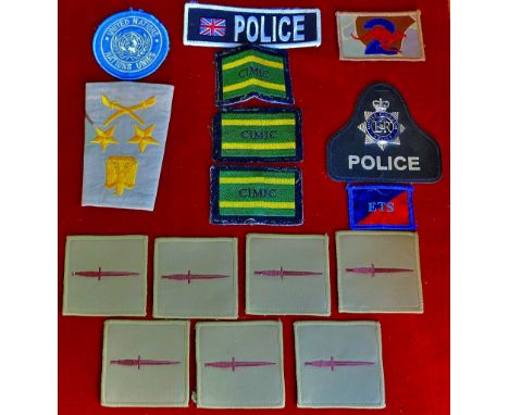 Cloth Patches (14) includes United Nations, SAS desert uniform patches (7), a Police patch with e white metal badge in the ce