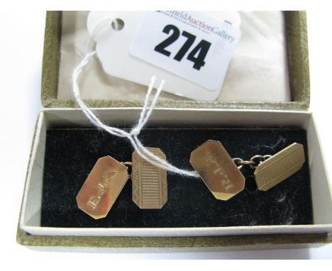 A Pair of 9ct Gold Gent's Cufflinks, engine turned and initialled, on chain connections.
